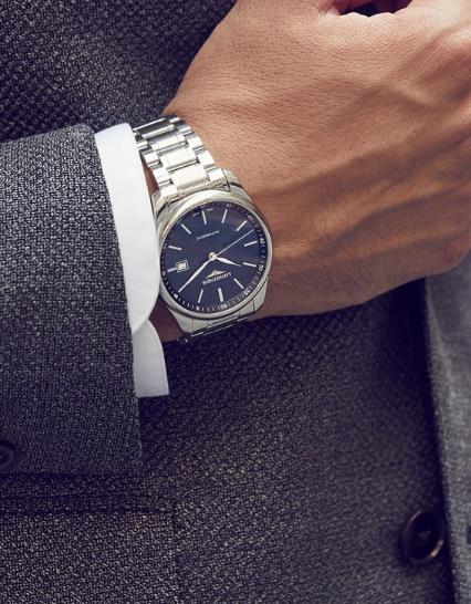The stainless steel copy watches have blue dials.